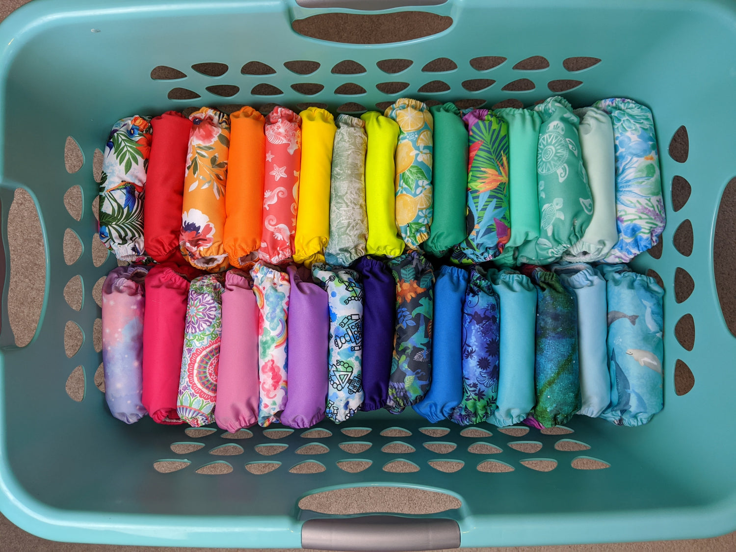 Blue basket of colorful cloth diapers